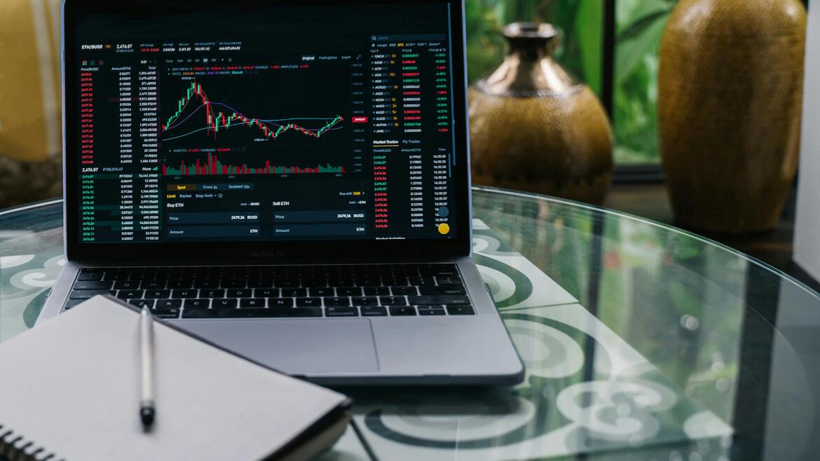 computer with a financial graph on the screen